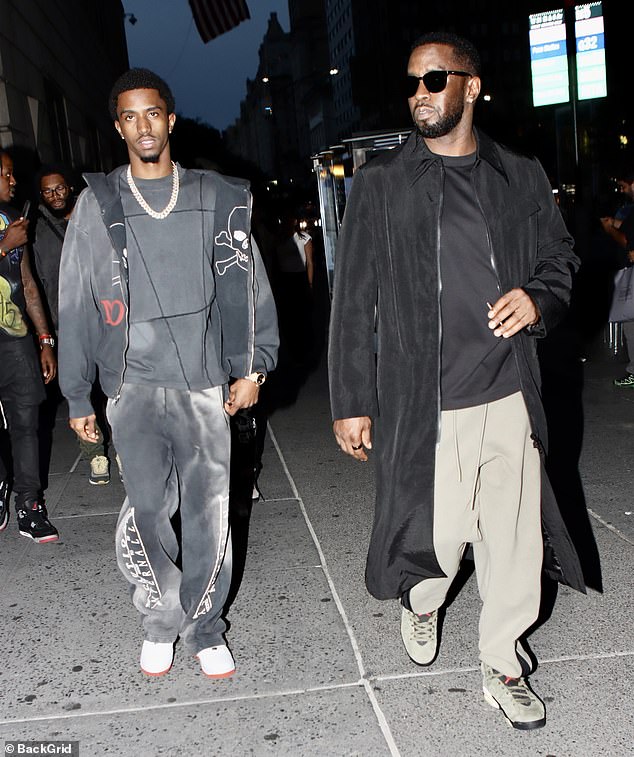 Sean 'Diddy' Combs, 45, was pictured hours before his arrest on a walk in midtown Manhattan with his son Christian Combs, 26, Monday