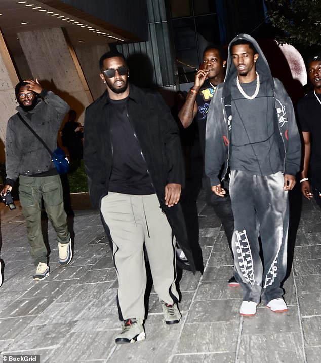 Christian, Combs' 26-year-old son with the late Kim Porter, was clad in a plush gray sweat suit with a gray t-shirt and white sneakers on the outing