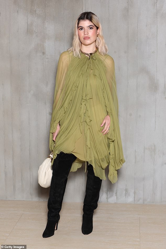 Molly Gallagher looked incredible in a floaty mesh moss green dress which she paired with some thigh high black boots