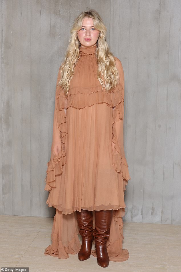 Anais Gallagher opted for a floaty nude dress and brown leather boots as she joined her cousin at the show