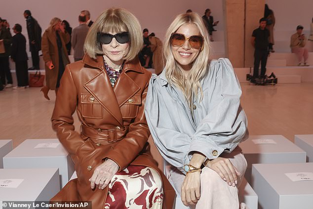 Sienna beamed beside fashion icon Anna Wintour who wore her usual signature sunglasses