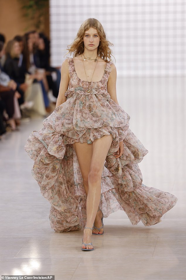 The models took to the runway as they put on a very leggy display in a stunning floral ruffled gown