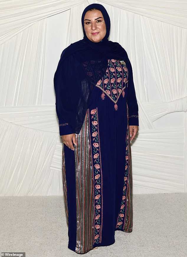 Reem Soud Jebreen Alhajara also made an appearance at the event in a dark blue ensemble that had pink floral details embroidered on the fabric