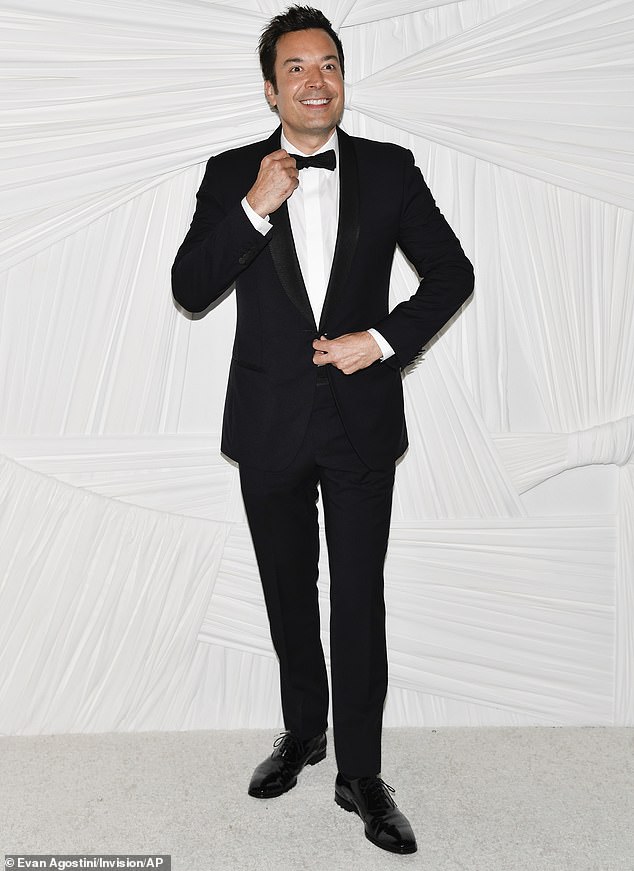 The Tonight Show host dressed to impress in a black suit which was paired with a white button up and black bowtie around the collar