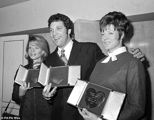 Jill Bennett, Tom Jones and Maggie Smith (left to right) with their silver hearts showbusiness awards from the Variety Club of Great Britain at the Savoy Hotel in London on March 11, 1969