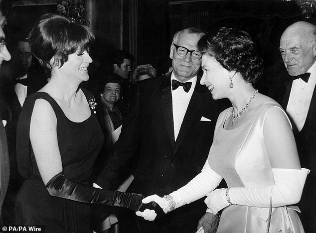 Queen Elizabeth II being presented to Dame Maggie Smith by Sir Laurence Olivier, when the Queen attended the charity premiere of the film Othello at the Odeon Theatre in London, on May 2, 1966