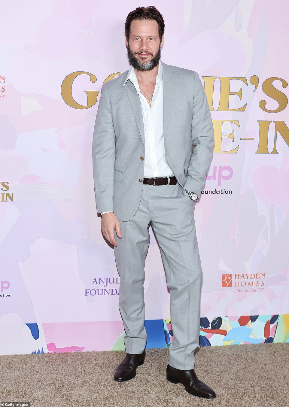 Ike Barinholtz wore a light gray suit as well as a white button up and black shoes while at the gala