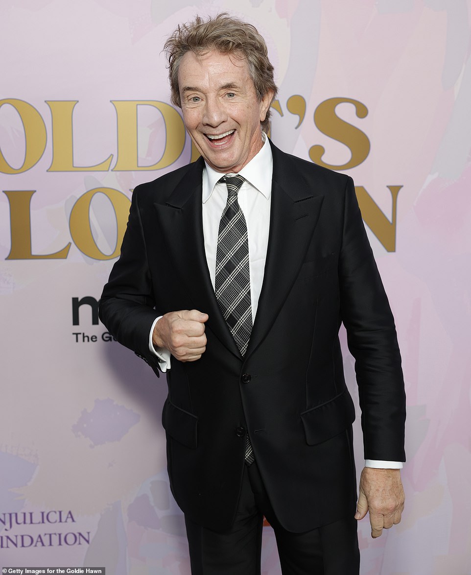 The star held a big smile on his face as he paused for a photo session upon arriving to the venue