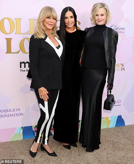 Griffith opted for a pair of black and white-colored sneakers to stay comfortable during the event
