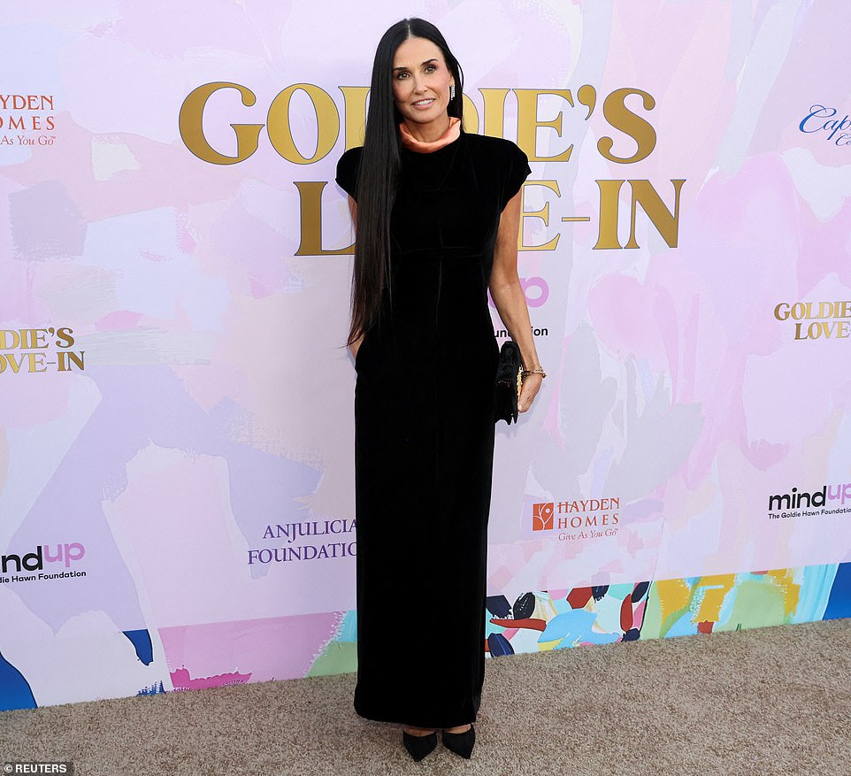 Other celebrities were also in attendance during the event, such as Demi Moore who stunned in a long, black velvet gown with capped sleeves and peach-colored fabric around the neckline