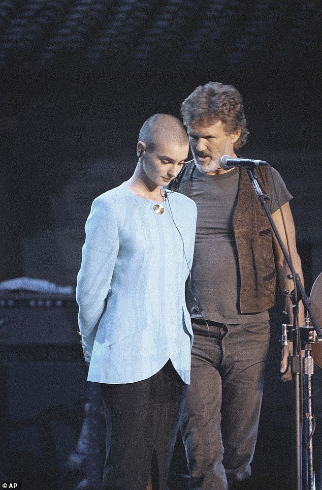 Amid news of Kris Kristofferson's death at the age of 88, a number of fans pointed out what they felt was one of his finest moments: When he came to the aid of the late Sinead O'Connor amid her Saturday Night Live scandal nearly 32 years ago. Pictured October 1992 in NYC