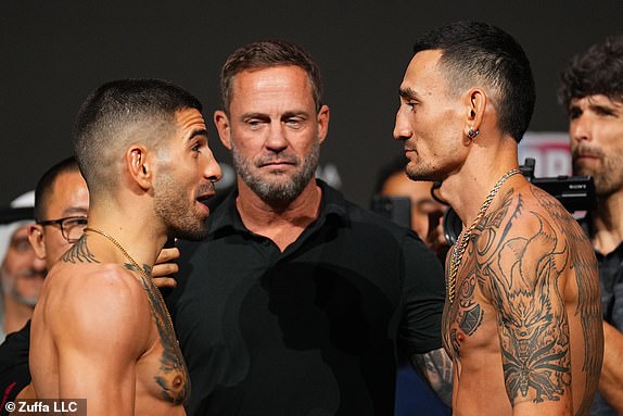 ABU DHABI, UNITED ARAB EMIRATES - OCTOBER 25: (L-R) Opponents Ilia Topuria of Spain and Max Holloway face off during the UFC 308 ceremonial weigh-in at Etihad Arena on October 25, 2024 in Abu Dhabi, United Arab Emirates. (Photo by Chris Unger/Zuffa LLC)