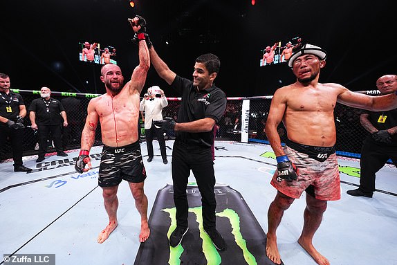 ABU DHABI, UNITED ARAB EMIRATES - OCTOBER 26: Mateusz Rebecki of Poland reacts after a split-decision victory against Myktybek Orolbai of Kyrgyzstan in a 160-pound catchweight fight during the UFC 308 event at Etihad Arena on October 26, 2024 in Abu Dhabi, United Arab Emirates.  (Photo by Chris Unger/Zuffa LLC)