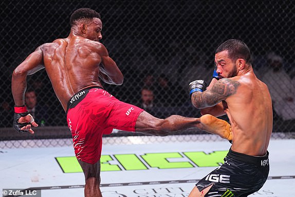 ABU DHABI, UNITED ARAB EMIRATES - OCTOBER 26: (L-R) Lerone Murphy of England kicks Dan Ige in a featherweight fight during the UFC 308 event at Etihad Arena on October 26, 2024 in Abu Dhabi, United Arab Emirates.  (Photo by Chris Unger/Zuffa LLC)