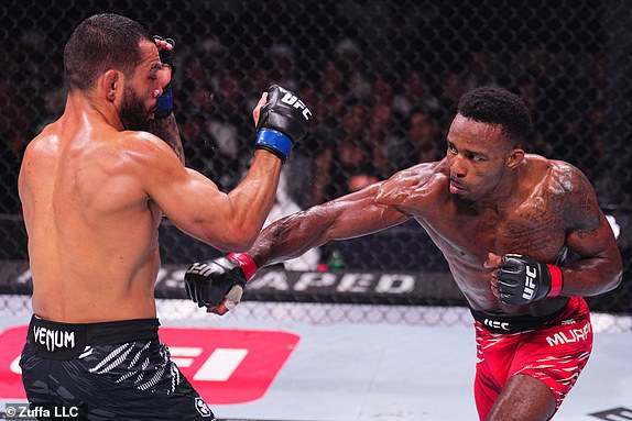 ABU DHABI, UNITED ARAB EMIRATES - OCTOBER 26: (R-L) Lerone Murphy of England punches Dan Ige in a featherweight fight during the UFC 308 event at Etihad Arena on October 26, 2024 in Abu Dhabi, United Arab Emirates.  (Photo by Chris Unger/Zuffa LLC)