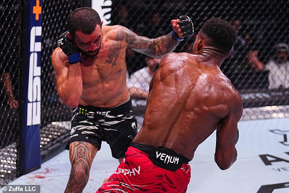 ABU DHABI, UNITED ARAB EMIRATES - OCTOBER 26: (L-R) Dan Ige battles Lerone Murphy of England in a featherweight fight during the UFC 308 event at Etihad Arena on October 26, 2024 in Abu Dhabi, United Arab Emirates.  (Photo by Chris Unger/Zuffa LLC)