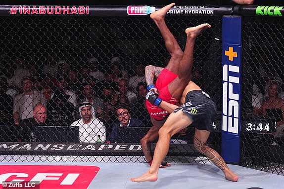 ABU DHABI, UNITED ARAB EMIRATES - OCTOBER 26: (R-L) Dan Ige takes down Lerone Murphy of England in a featherweight fight during the UFC 308 event at Etihad Arena on October 26, 2024 in Abu Dhabi, United Arab Emirates.  (Photo by Chris Unger/Zuffa LLC)