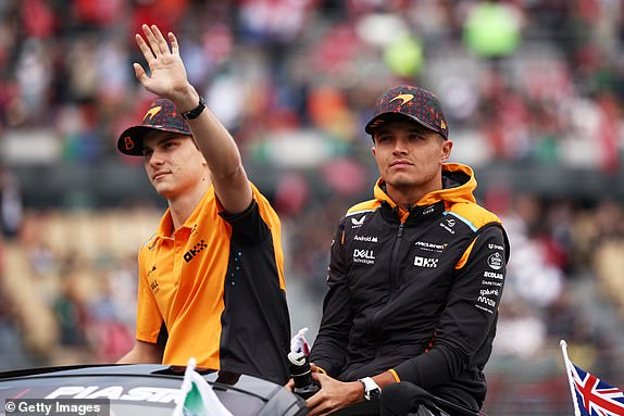 MEXICO CITY, MEXICO - OCTOBER 27: Lando Norris of Great Britain and McLaren and Oscar Piastri of Australia and McLaren looks on from the drivers parade prior to the F1 Grand Prix of Mexico at Autodromo Hermanos Rodriguez on October 27, 2024 in Mexico City, Mexico. (Photo by Jared C. Tilton/Getty Images)