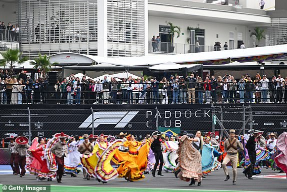 MEXICO CITY, MEXICO - OCTOBER 27: Traditionally dressed performers entertain the crowd prior to the F1 Grand Prix of Mexico at Autodromo Hermanos Rodriguez on October 27, 2024 in Mexico City, Mexico. (Photo by Rudy Carezzevoli/Getty Images)