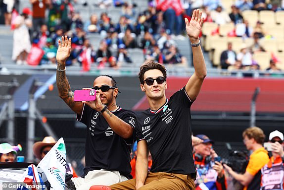 MEXICO CITY, MEXICO - OCTOBER 27: Lewis Hamilton of Great Britain and Mercedes and George Russell of Great Britain and Mercedes wave to the crowd on the drivers parade prior to the F1 Grand Prix of Mexico at Autodromo Hermanos Rodriguez on October 27, 2024 in Mexico City, Mexico. (Photo by Mark Thompson/Getty Images)