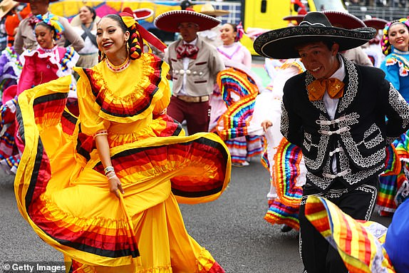 MEXICO CITY, MEXICO - OCTOBER 27: Traditionally dressed performers entertain the crowd prior to the F1 Grand Prix of Mexico at Autodromo Hermanos Rodriguez on October 27, 2024 in Mexico City, Mexico. (Photo by Mark Thompson/Getty Images)