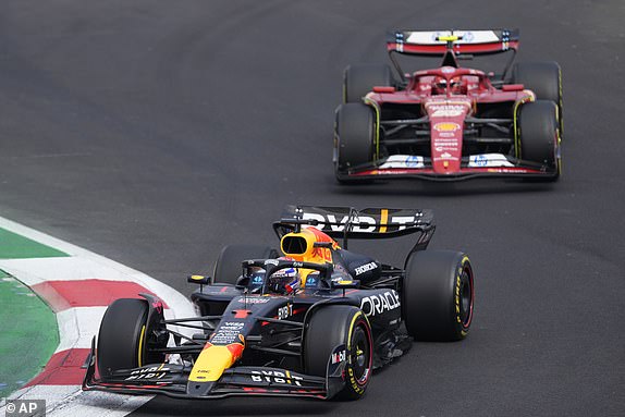 Red Bull driver Max Verstappen of the Netherlands steers his car followed by Ferrari driver Carlos Sainz of Spain after the start of the Formula One Mexico Grand Prix auto race at the Hermanos Rodriguez racetrack in Mexico City, Sunday, Oct. 27, 2024. (AP Photo/Eduardo Verdugo)