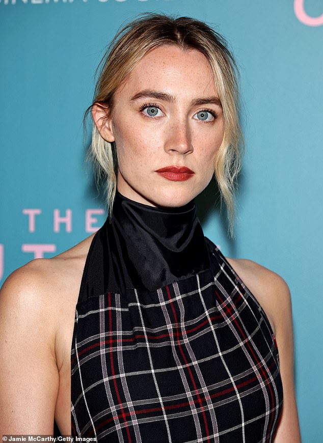 Make-up artist Yukari Obayashi Bush brought out Ronan's baby blues with defined brows, chiseled cheekbones, and a red pout