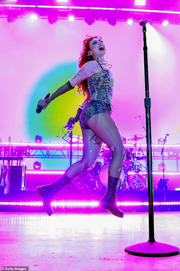 She stomped around the colorfully lit stage in her go-to black combat boots