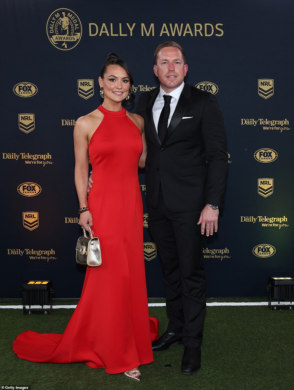 Retired Roosters star Mitch Aubusson looked dapper in a black and white suit alongside his stunning wife Laura Aubusson