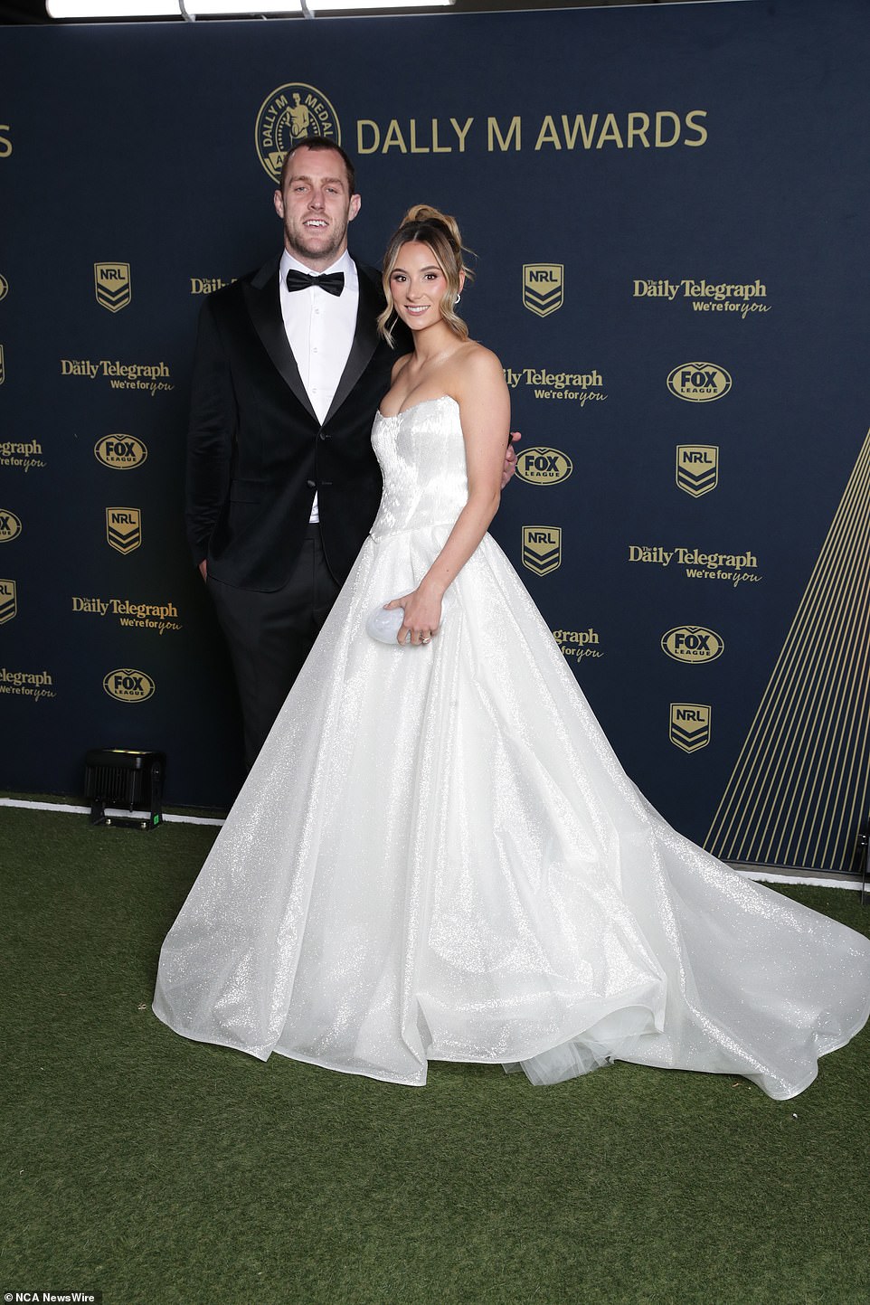 Panthers skipper Isaah Yeo's wife Ashley wore a strapless white bridal gown complete with a marble white clutch bag