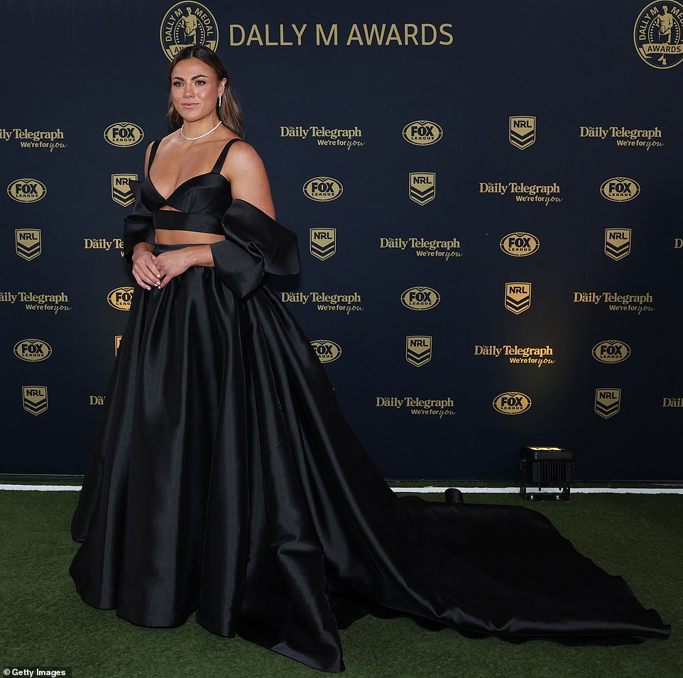 Millie Elliott of the Roosters made an incredibly grand entrance in a black KWH Bridal gown