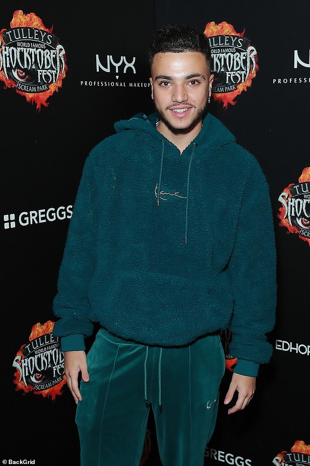The young musician cut a causal figure in a green tracksuit as he hit the red carpet