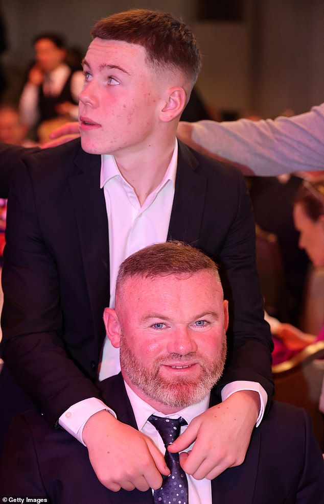 Kai was seen posing with dad Wayne during the awards