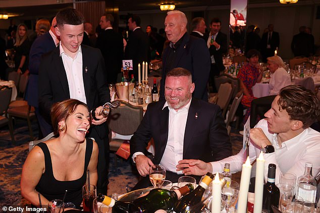 Wayne was joined by his eldest son Kai as he accepted the award, with Coleen proudly watching on