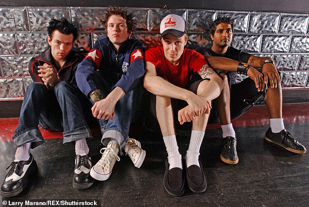 Whibley is pictured with bandmates Steve Jocz, Jason McCaslin and Dave Baksh in 2003 - while still working with Nori