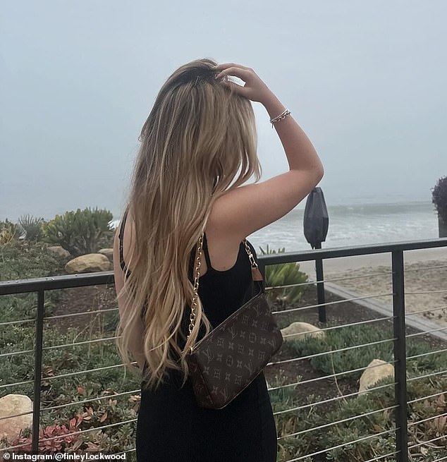 She could be seen looking out towards the sandy shore and the waves crashing down nearby