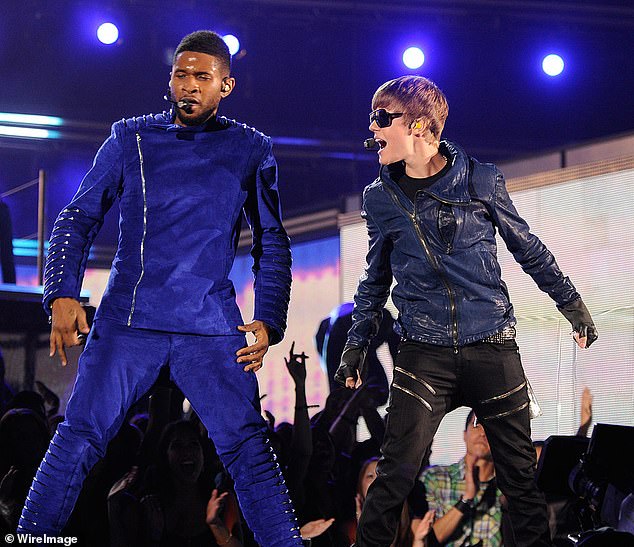 Usher and Justin pictured performing onstage during the 53rd GRAMMY Awards in 2011