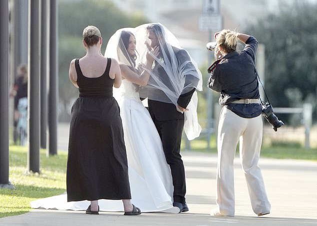 Taylor and her new husband cuddled up for a series of stunning photos, at once stage laughing as they embraced under Taylor's veil