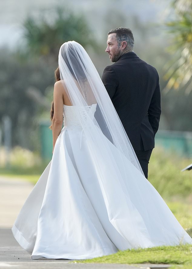 Her veil flowed behind her for a classic silhouette