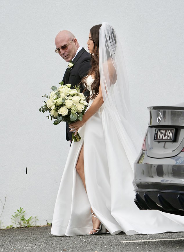 Taylor appeared to be walked down the aisle by her father