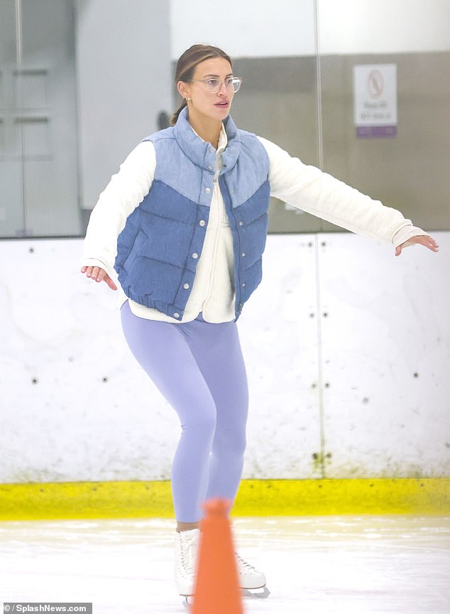 She swept her brunette locks back into a ponytail and accessorised with dainty silver jewellery