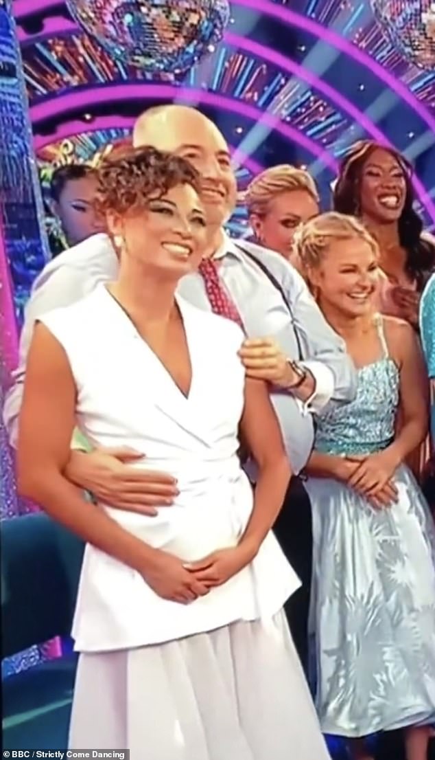 During the fourth live show, as host Claudia Winkleman revealed this week's voting lines were open, Wynne, 52, put his arm around Katya's waist before she appeared to take his hand off