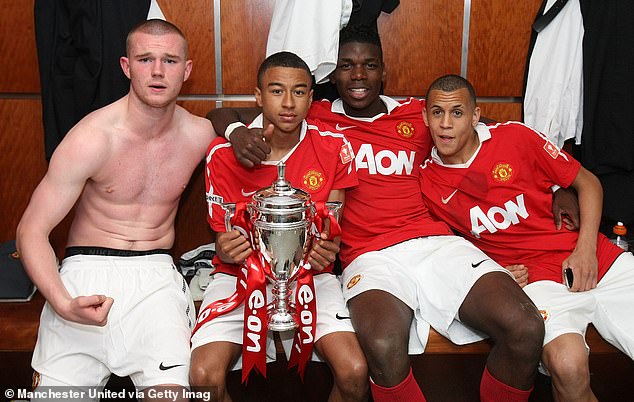 Pogba and Ravel Morrison (far right) celebrate Man United's FA Youth Cup Final triumph over Sheffield United in 2011, alongside Ryan Tunnicliffe (left) and Jesse Lingard (second left)