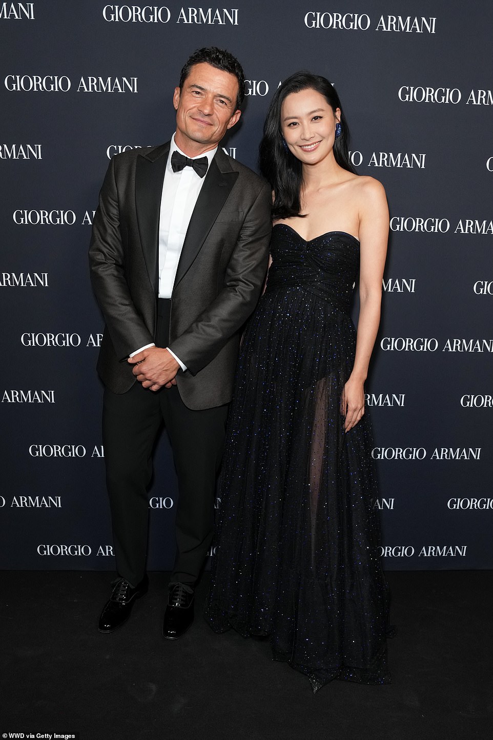 Instead of his fiancee Katy Perry, Orlando posed for photos on the red carpet with the stunning actress Fala Chen