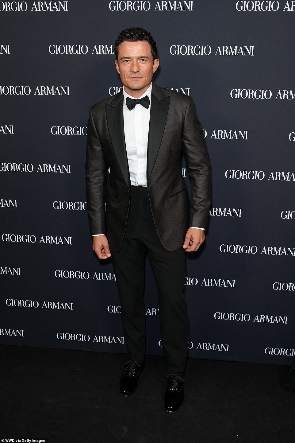 Orlando Bloom smoldered for shutterbugs while rocking a Giorgio Armani tuxedo