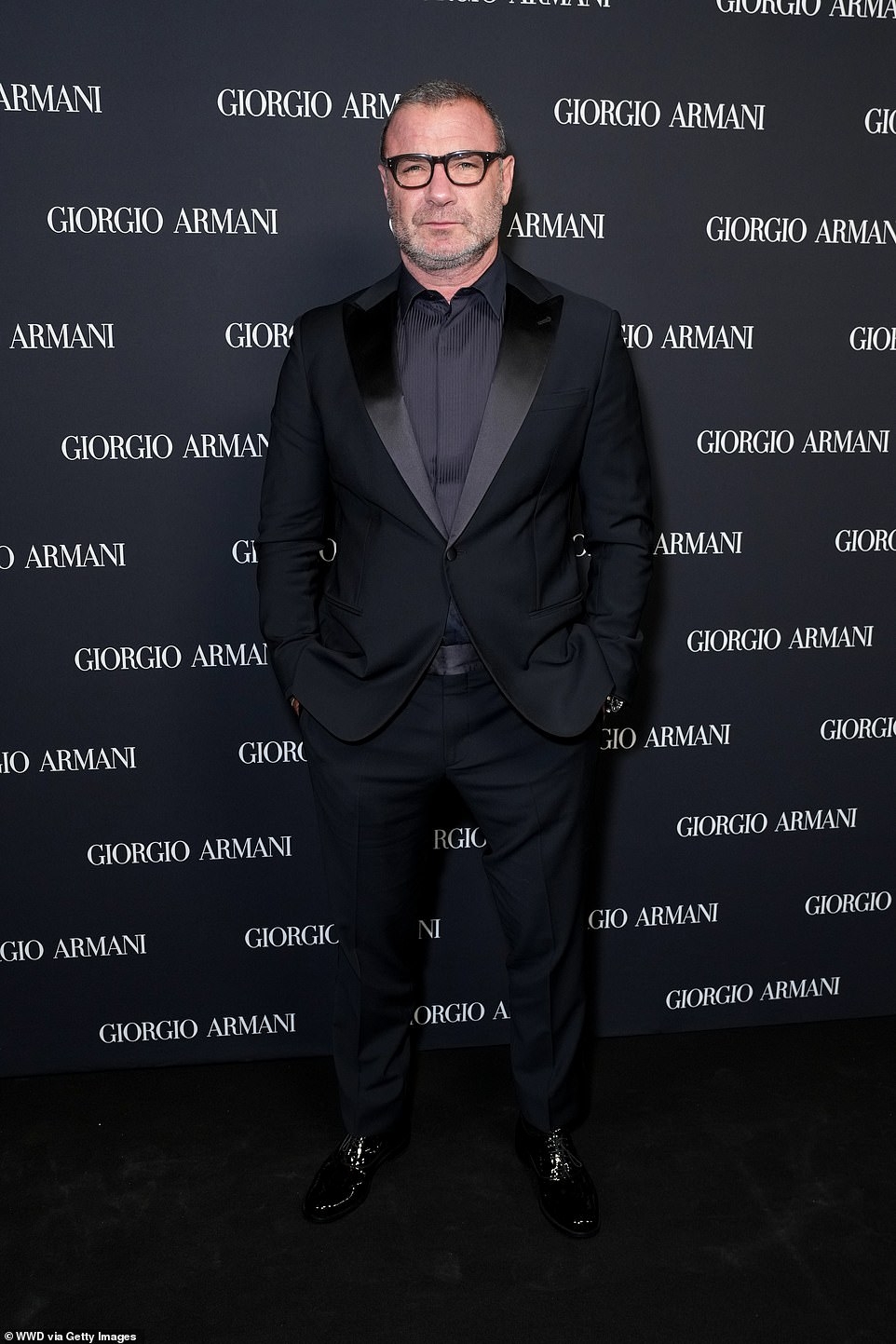 The Ray Donovan star, 57, sported a tuxedo jacket over a dress shirt and slacks