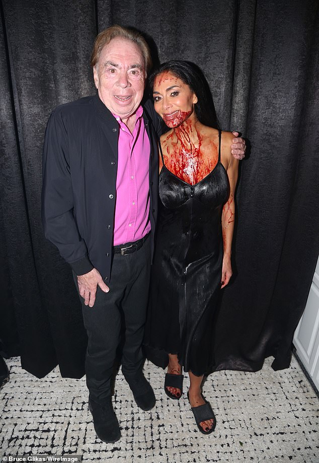 She also came out to pose for photos alongside composer Andrew Lloyd Webber , while covered in fake blood