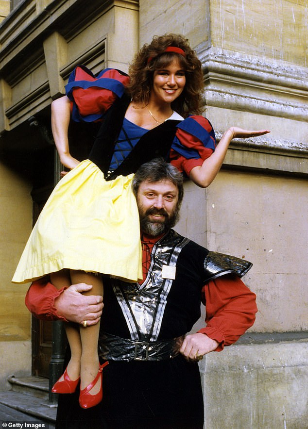 Linda Lusardi who stars in the pantomime 'Snow White and the Seven Dwarfs' at the Theatre Royal Newcastle, poses with Geoff Capes who plays Odd Job, 17th December 1991