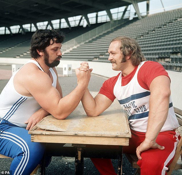 Policeman Geoff Capes (right), Commonwealth shot putt champion, and Al Feuerbach, American holder of the world record at Crystal Palace, London