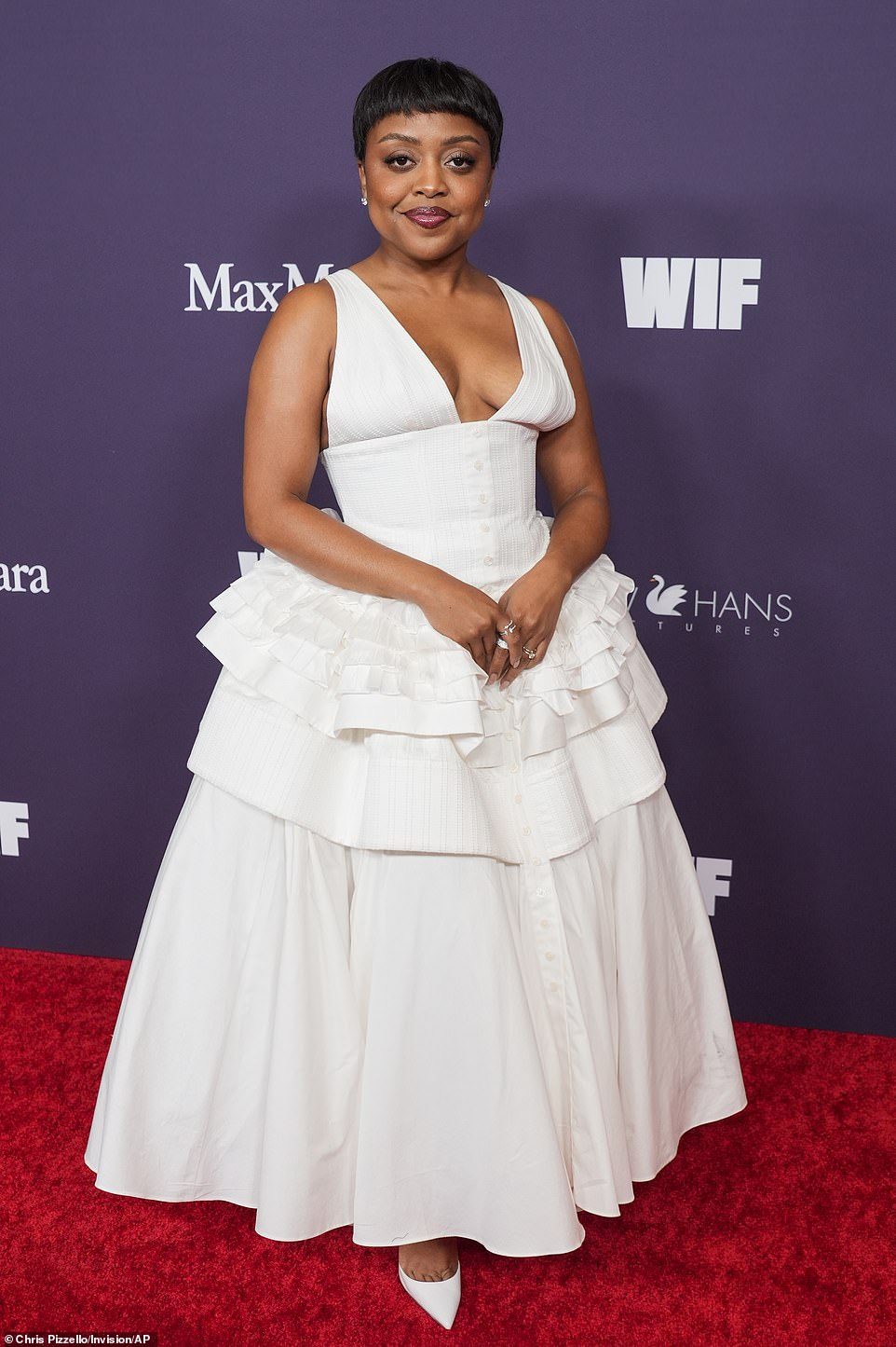 Quinta Brunson, 34, wowed in a plunging white dress with an elegant ruffled skirt